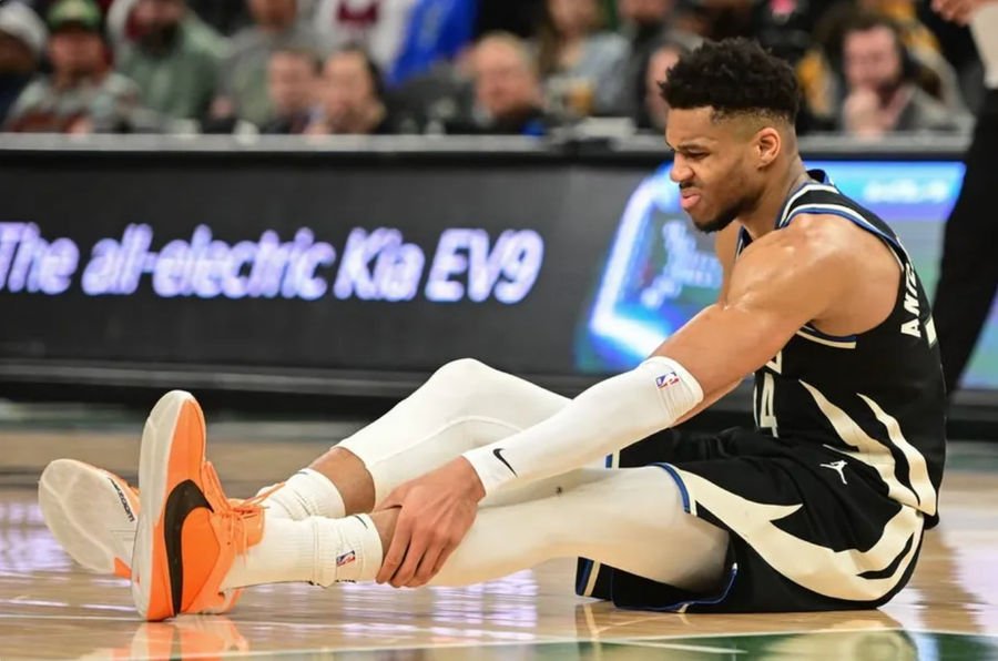 Apr 9, 2024; Milwaukee, Wisconsin, USA; Milwaukee Bucks forward Giannis Antetokounmpo (34) grabs his leg in the third quarter and left game against the Boston Celtics with an injury at Fiserv Forum. credits: Benny Sieu-USA TODAY Sports