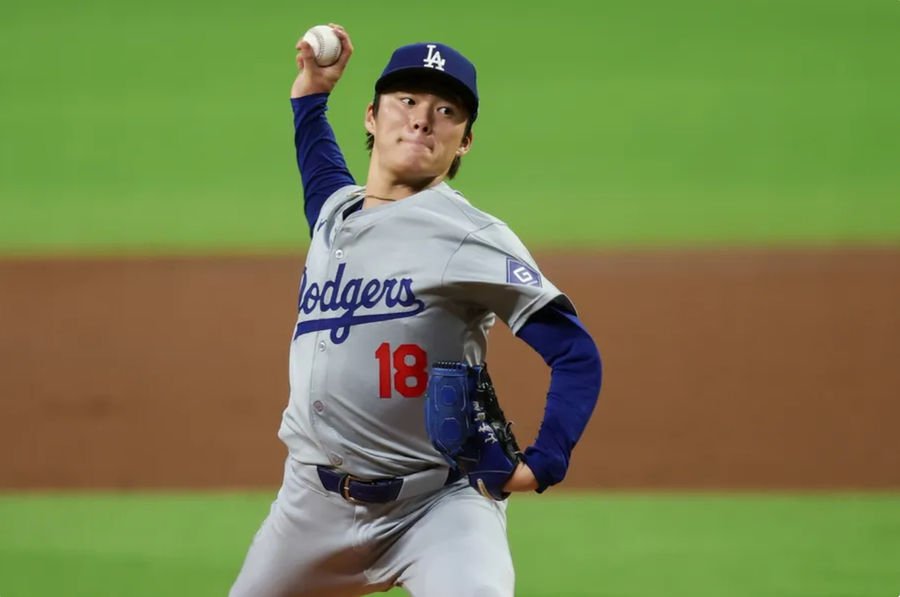 Sep 16, 2024; Atlanta, Georgia, USA; Los Angeles Dodgers starting pitcher Yoshinobu Yamamoto (18) throws against the Atlanta Braves in the third inning at Truist Park. Mandatory Credit: Brett Davis-Imagn Images