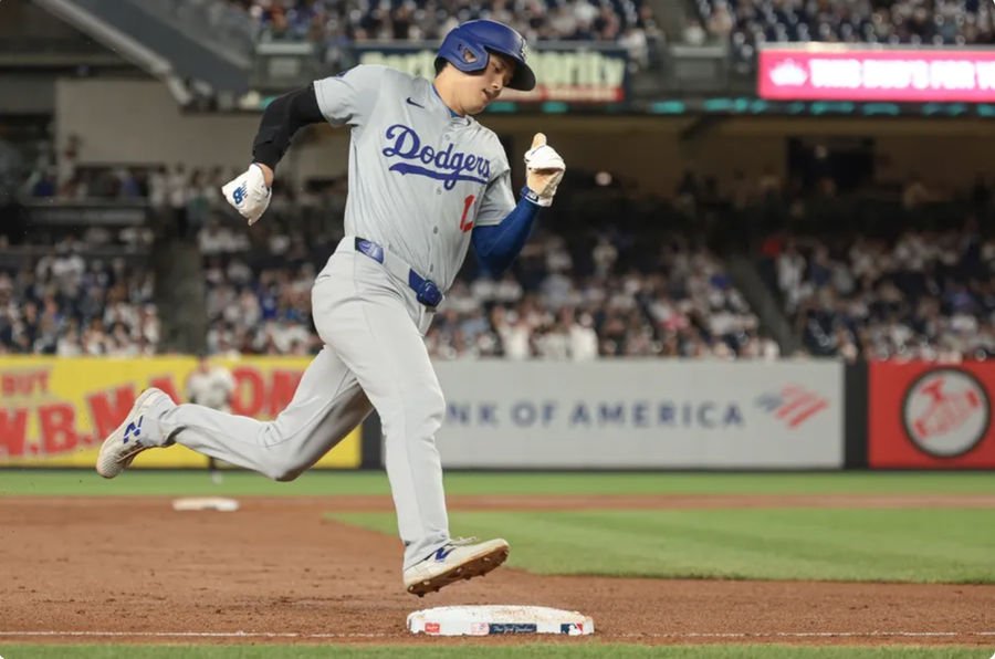 Jun 8, 2024; Bronx, New York, USA; Los Angeles Dodgers designated hitter Shohei Ohtani (17) rounds third base and scores on an double by first baseman Freddie Freeman (not pictured) during the ninth inning against the New York Yankees at Yankee Stadium. Mandatory Credit: Vincent Carchietta-Imagn Images