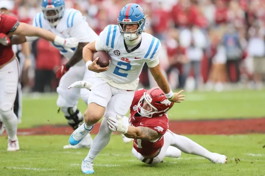 Nov 2, 2024; Fayetteville, Arkansas, USA; Ole Miss Rebels quarterback Jaxson Dart (2) rushes in the first quarter against the Arkansas Razorbacks at Donald W. Reynolds Razorback Stadium. Mandatory Credit: Nelson Chenault-Imagn Images