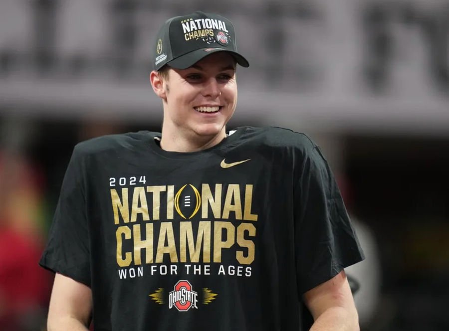 Jan 20, 2025; Atlanta, GA, USA; Ohio State Buckeyes quarterback Will Howard (18) on the podium after defeating the Notre Dame Fighting Irish in the CFP National Championship college football game at Mercedes-Benz Stadium. Mandatory Credit: Kirby Lee-Imagn Images