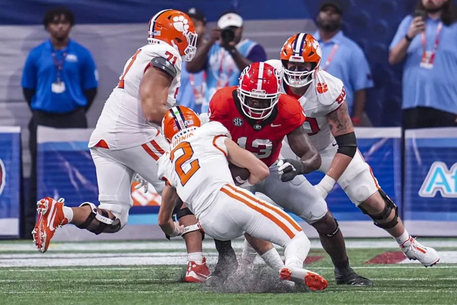 Aug 31, 2024; Atlanta, Georgia, USA; Georgia Bulldogs defensive lineman Mykel Williams (13) tackles Clemson Tigers quarterback Cade Klubnik (2) during the second half at Mercedes-Benz Stadium. Mandatory Credit: Dale Zanine-Imagn Images