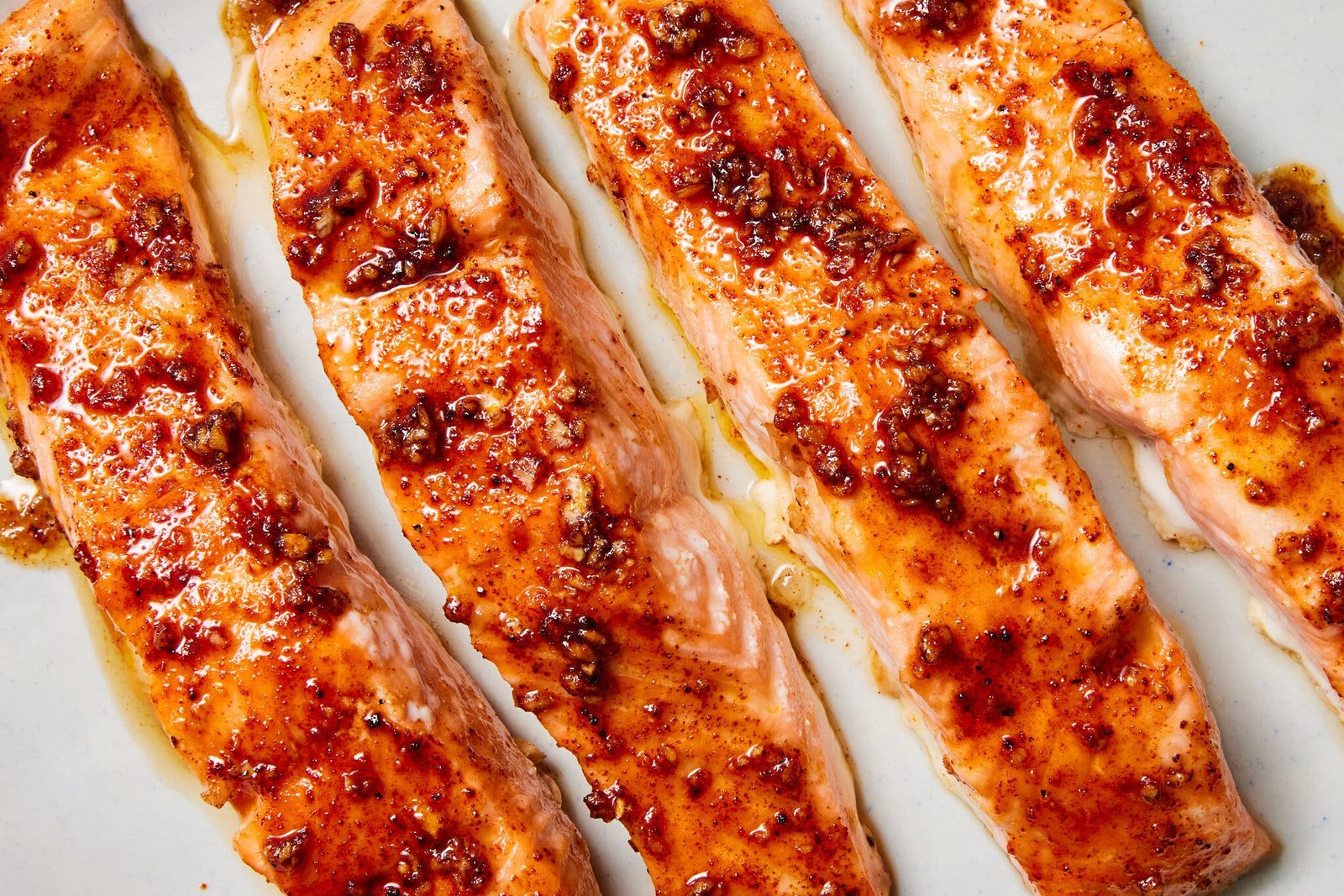 An overhead image of four salmon fillets.