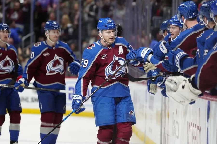 Mar 25, 2025; Denver, Colorado, USA; Colorado Avalanche center Nathan MacKinnon (29) celebrates his goal in the third period against the Detroit Red Wings at Ball Arena. Mandatory Credit: Ron Chenoy-Imagn Images