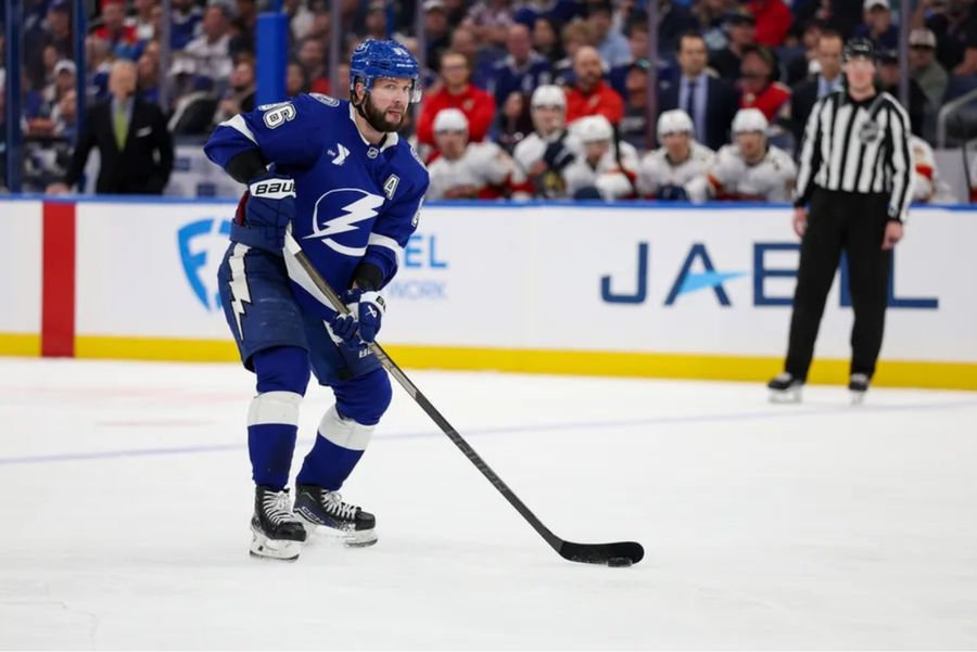 Dec 22, 2024; Tampa, Florida, USA; Tampa Bay Lightning right wing Nikita Kucherov (86) controls the puck against the Florida Panthers in the third period at Amalie Arena. Mandatory Credit: Nathan Ray Seebeck-Imagn Images