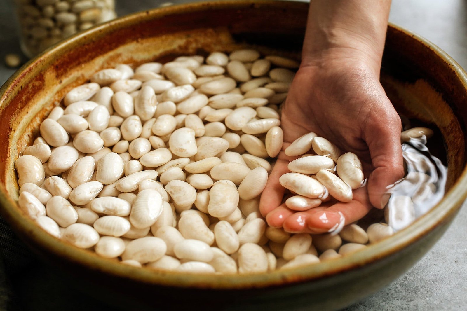 A side image of beans soaking in water.