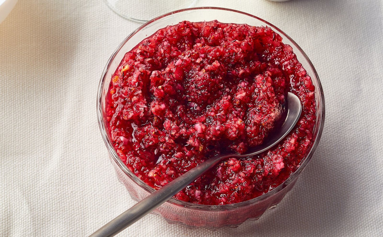An overhead image of cranberry relish in a glass bowl.