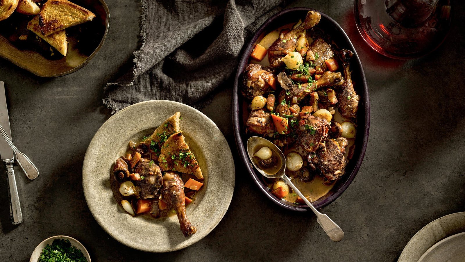 An overhead image of coq au vin in a baking dish and as a single serving.
