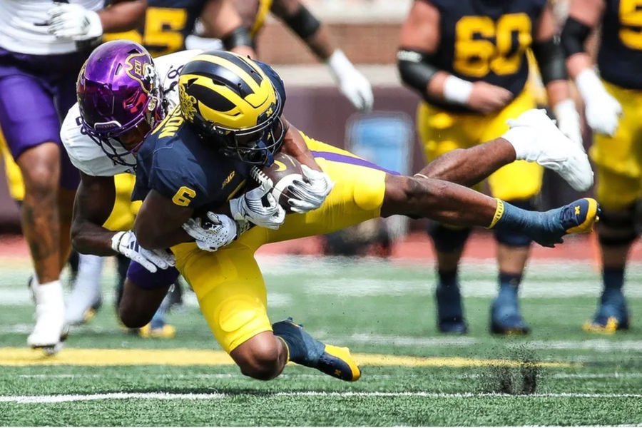 Michigan wide receiver Cornelius Johnson makes a catch against East Carolina defensive back Shavon Revel during the second half of U-M's 30-3 win on Saturday, Sept. 2, 2023, at Michigan Stadium. PHOTO USA TODAY SPORTS IMAGES