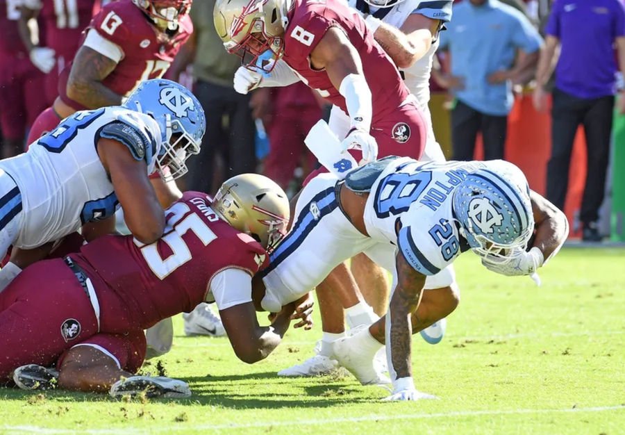 Nov 2, 2024; Tallahassee, Florida, USA; North Carolina Tarheels running back Omarian Hampton (28) runs the ball against the Florida State Seminoles during the first quarter at Doak S. Campbell Stadium. Mandatory Credit: Robert Myers-Imagn Images