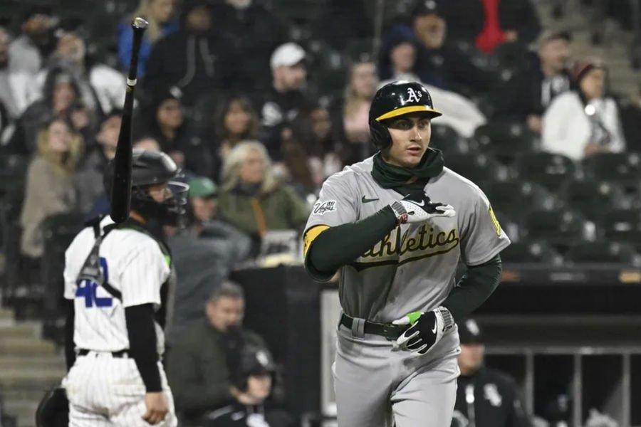 Apr 15, 2025; Chicago, Illinois, USA; Athletics first baseman Tyler Soderstrom (21) flips his bat after he hits a three run home run against the Chicago White Sox during the sixth inning at Rate Field. “All players wore #42 for Jackie Robinson Day” Mandatory Credit: Matt Marton-Imagn Images.