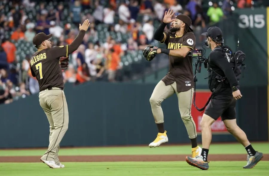 Apr 20, 2025; Houston, Texas, USA;San Diego Padres right fielder Fernando Tatis Jr. (23) and second baseman Jose Iglesias (7) celebrate defeating the Houston Astros at Daikin Park. Mandatory Credit: Thomas Shea-Imagn Images