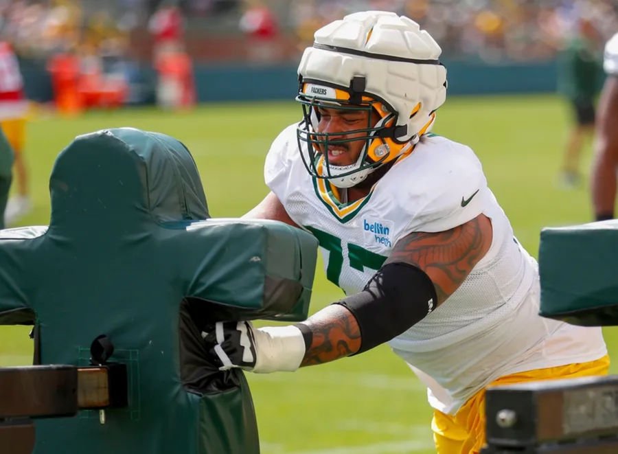 Green Bay Packers offensive lineman Jordan Morgan (77) runs through a drill during the 11th practice of training camp on Tuesday, August 6, 2024, at Ray Nitschke Field in Ashwaubenon, Wis. Tork Mason/USA TODAY NETWORK-Wisconsin