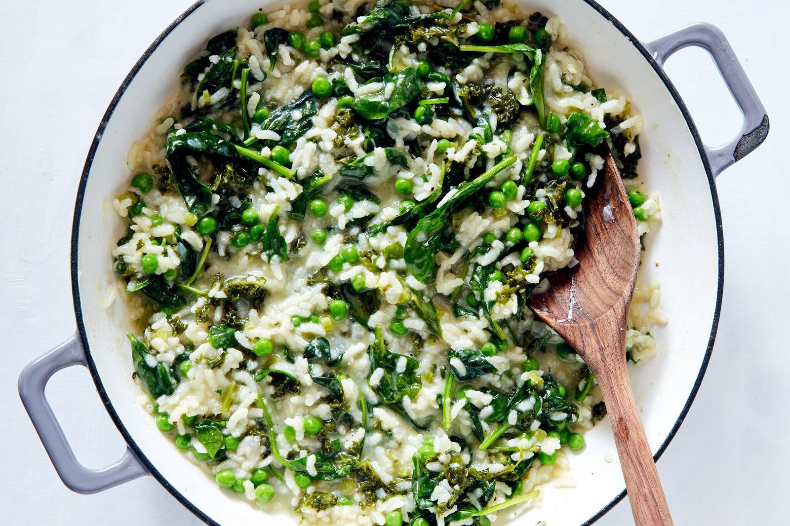 An overhead image of a spring green risotto in a Dutch oven.