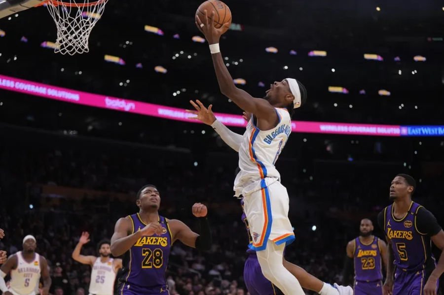 Nov 29, 2024; Los Angeles, California, USA; Oklahoma City Thunder guard Shai Gilgeous-Alexander (2) shoots the ball against the Los Angeles Lakers in the second half at Crypto.com Arena. Mandatory Credit: Kirby Lee-Imagn Images