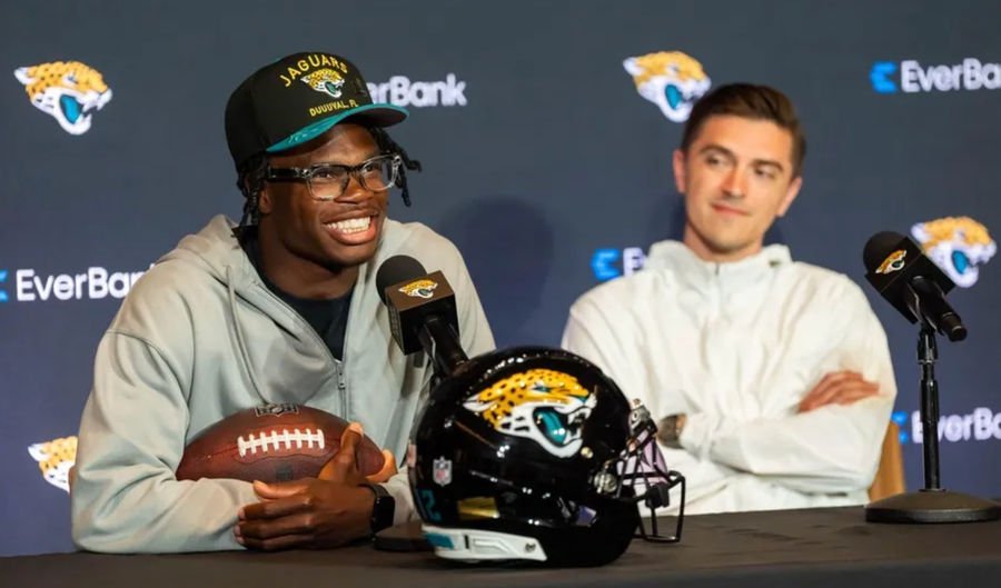 The Jacksonville Jaguars’ first-round pick, Colorado Buffaloes wide receiver and defensive back Travis Hunter, left, answers questions as General Manager James Gladstone, right, sits next to him during a press conference Friday, March 25, 2025 at Miller Electric Center in Jacksonville, Fla. [Doug Engle/Florida Times-Union]