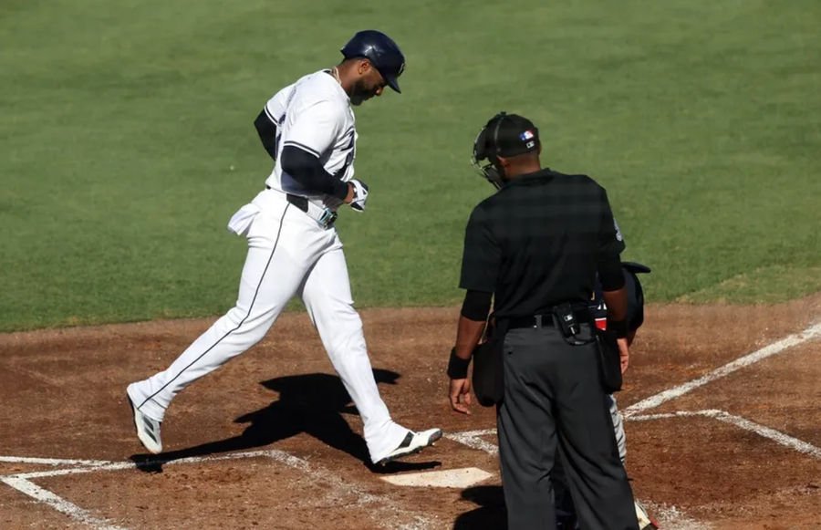 Apr 12, 2025; St. Petersburg, Florida, USA; Tampa Bay Rays designated hitter Yandy Diaz (2) scores a run against the Atlanta Braves during the third inning at George M. Steinbrenner Field. Mandatory Credit: Kim Klement Neitzel-Imagn Images
