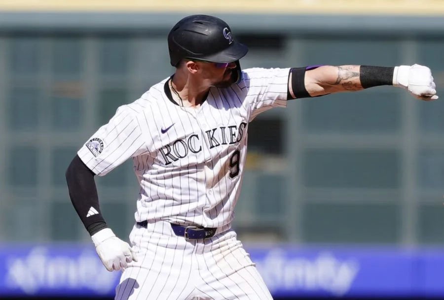 Apr 10, 2025; Denver, Colorado, USA; Colorado Rockies outfielder Brenton Doyle (9) reacts after a two run double against the Milwaukee Brewers at Coors Field. Mandatory Credit: Ron Chenoy-Imagn Images