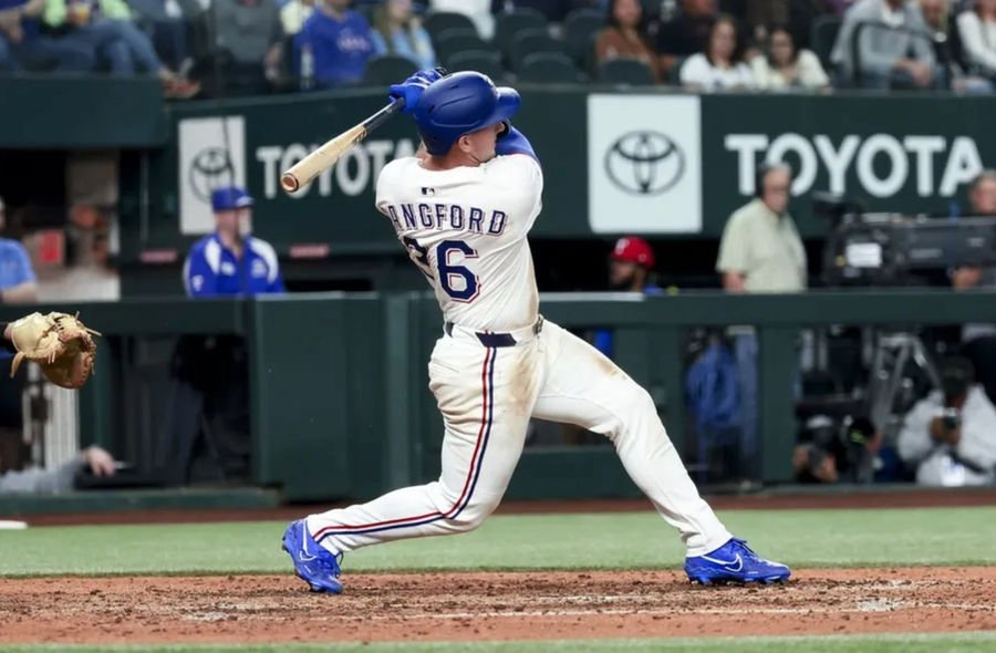 Apr 5, 2025; Arlington, Texas, USA; Texas Rangers left fielder Wyatt Langford (36) hits a two-run home run during the seventh inning against the Tampa Bay Rays at Globe Life Field. Mandatory Credit: Kevin Jairaj-Imagn Images
