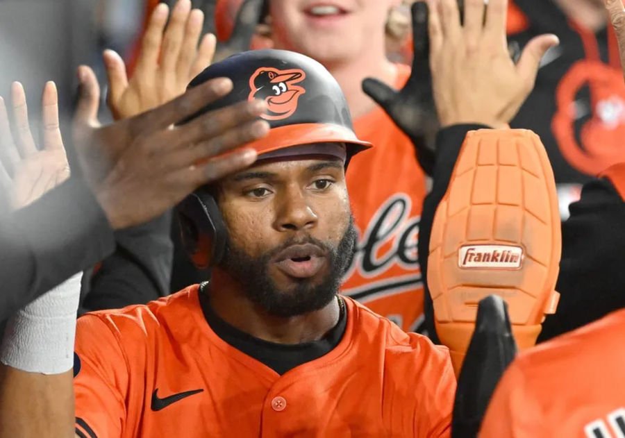 Mar 29, 2025; Toronto, Ontario, CAN; Baltimore Orioles center fielder Cedric Mullins (31) celebrates with team mates in the dugout after scoring a run against the Toronto Blue Jays in the fourth inning at Rogers Centre. Mandatory Credit: Dan Hamilton-Imagn Images