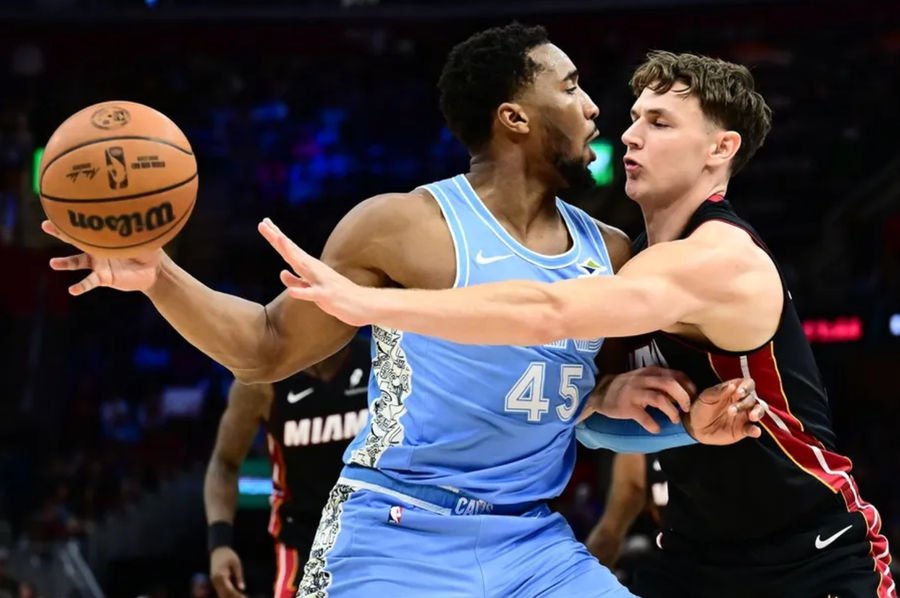 Mar 5, 2025; Cleveland, Ohio, USA; Miami Heat guard Pelle Larsson (9) defends Cleveland Cavaliers guard Donovan Mitchell (45) during the second half at Rocket Arena. Mandatory Credit: Ken Blaze-Imagn Images