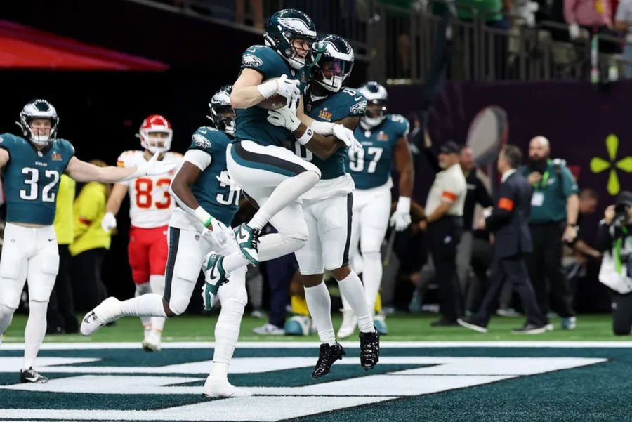Feb 9, 2025; New Orleans, LA, USA; Philadelphia Eagles cornerback Cooper DeJean (33) celebrates with teammates after returning an interception for a touchdown against the Kansas City Chiefs during the first half of Super Bowl LIX at Caesars Superdome. Mandatory Credit: Geoff Burke-Imagn Images