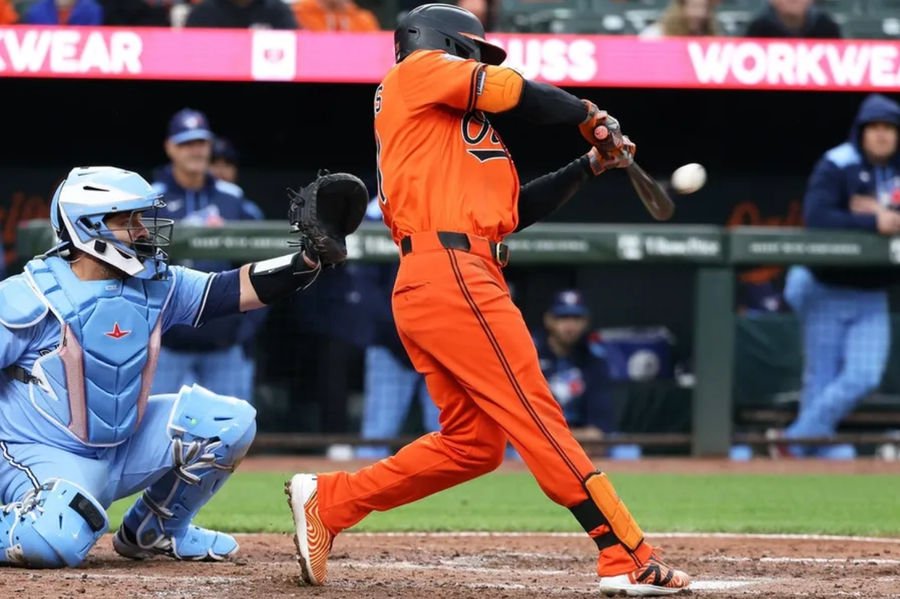Apr 12, 2025; Baltimore, Maryland, USA; Baltimore Orioles outfielder Cedric Mullins (31) hits an RBI double during the sixth inning against the Toronto Blue Jays at Oriole Park at Camden Yards. Mandatory Credit: Daniel Kucin Jr.-Imagn Images