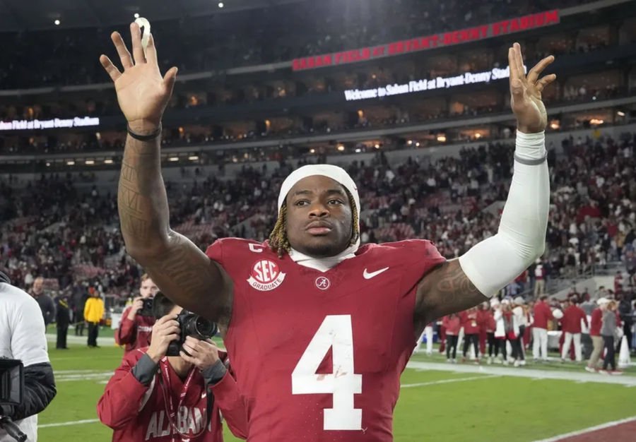 Nov 30, 2024; Tuscaloosa, Alabama, USA; Alabama Crimson Tide quarterback Jalen Milroe (4) celebrates after defeating the Auburn Tigers at Bryant-Denny Stadium. Alabama won 28-14. Mandatory Credit: Gary Cosby Jr.-Imagn Images