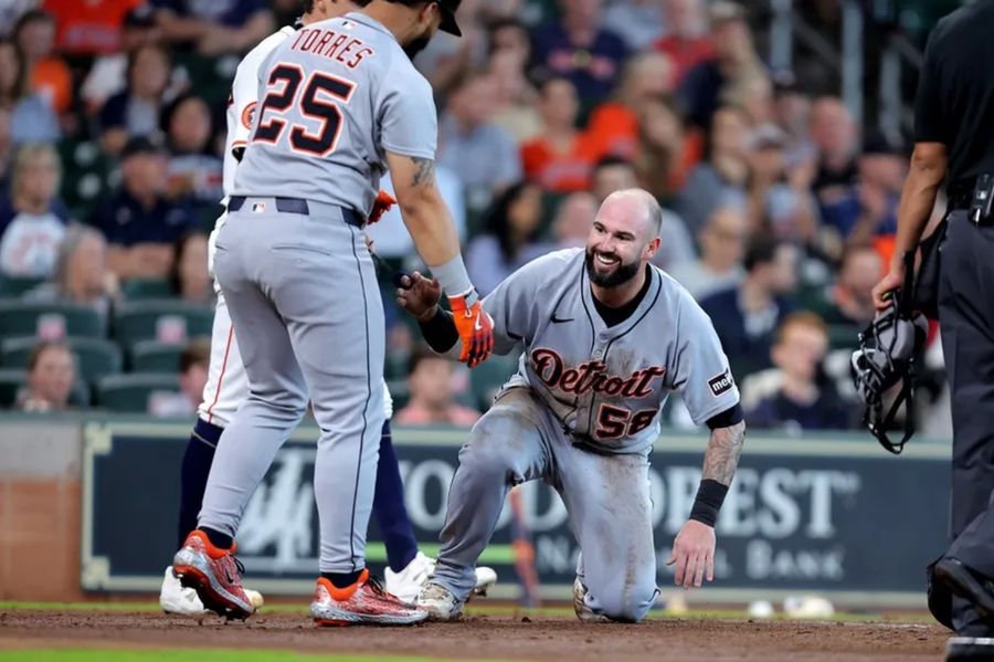 Apr 30, 2025; Houston, Texas, USA; Detroit Tigers catcher Tomas Nido (58) is helped up by Detroit Tigers second baseman Gleyber Torres (25) after scoring a run against the Houston Astros during the third inning at Daikin Park. Mandatory Credit: Erik Williams-Imagn Images